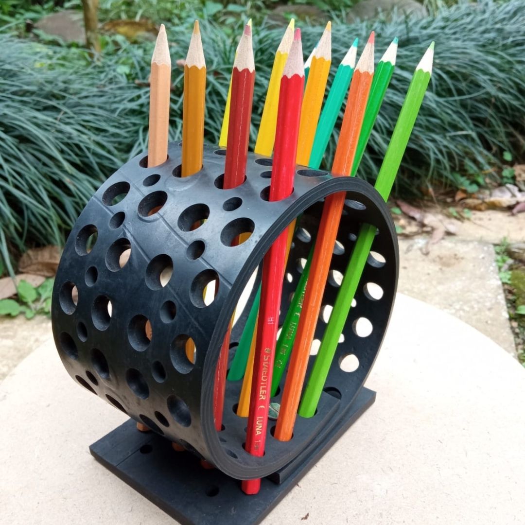 Colorful Dotty Eco-Friendly Pencil/Pen Holder made from upcycled rubber, featuring a unique spiky design with multiple holes for organizing pens and brushes.