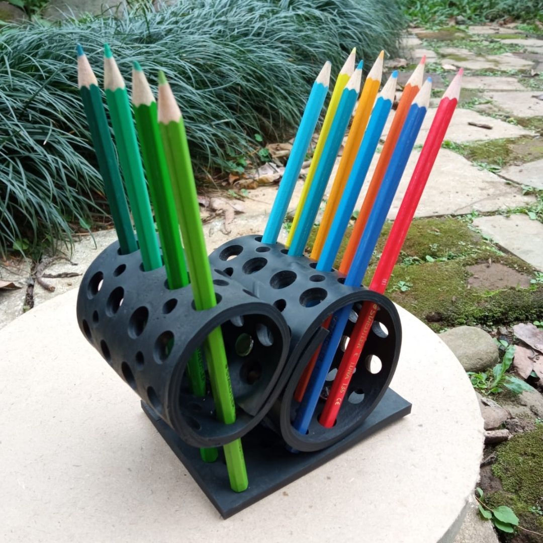 Colorful Dotty Eco-Friendly Pencil/Pen Holder made from upcycled rubber, featuring a unique spiky design with multiple holes for organizing pens and brushes.