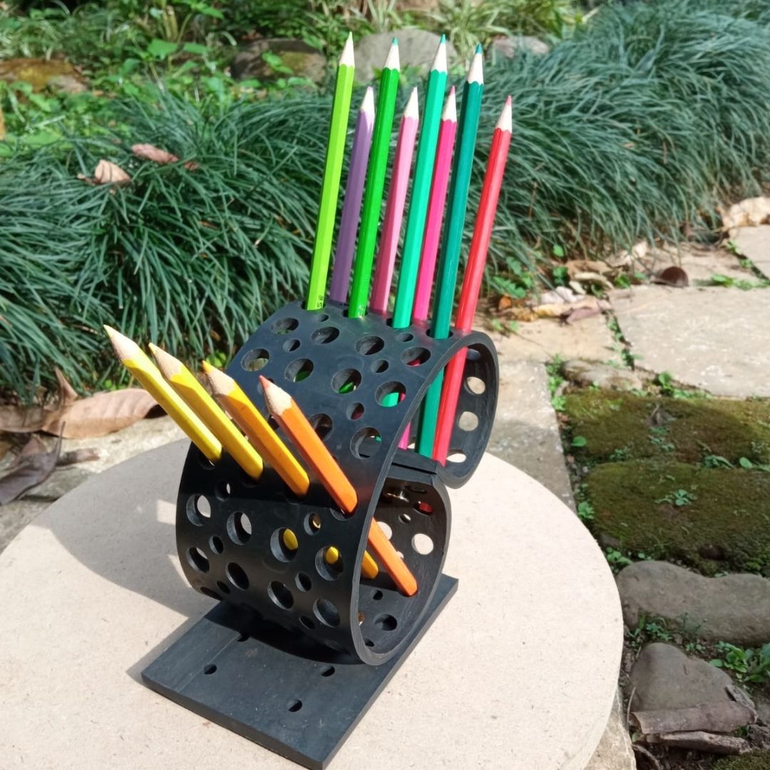 Colorful Dotty Eco-Friendly Pencil/Pen Holder made from upcycled rubber, featuring a unique spiky design with multiple holes for organizing pens and brushes.