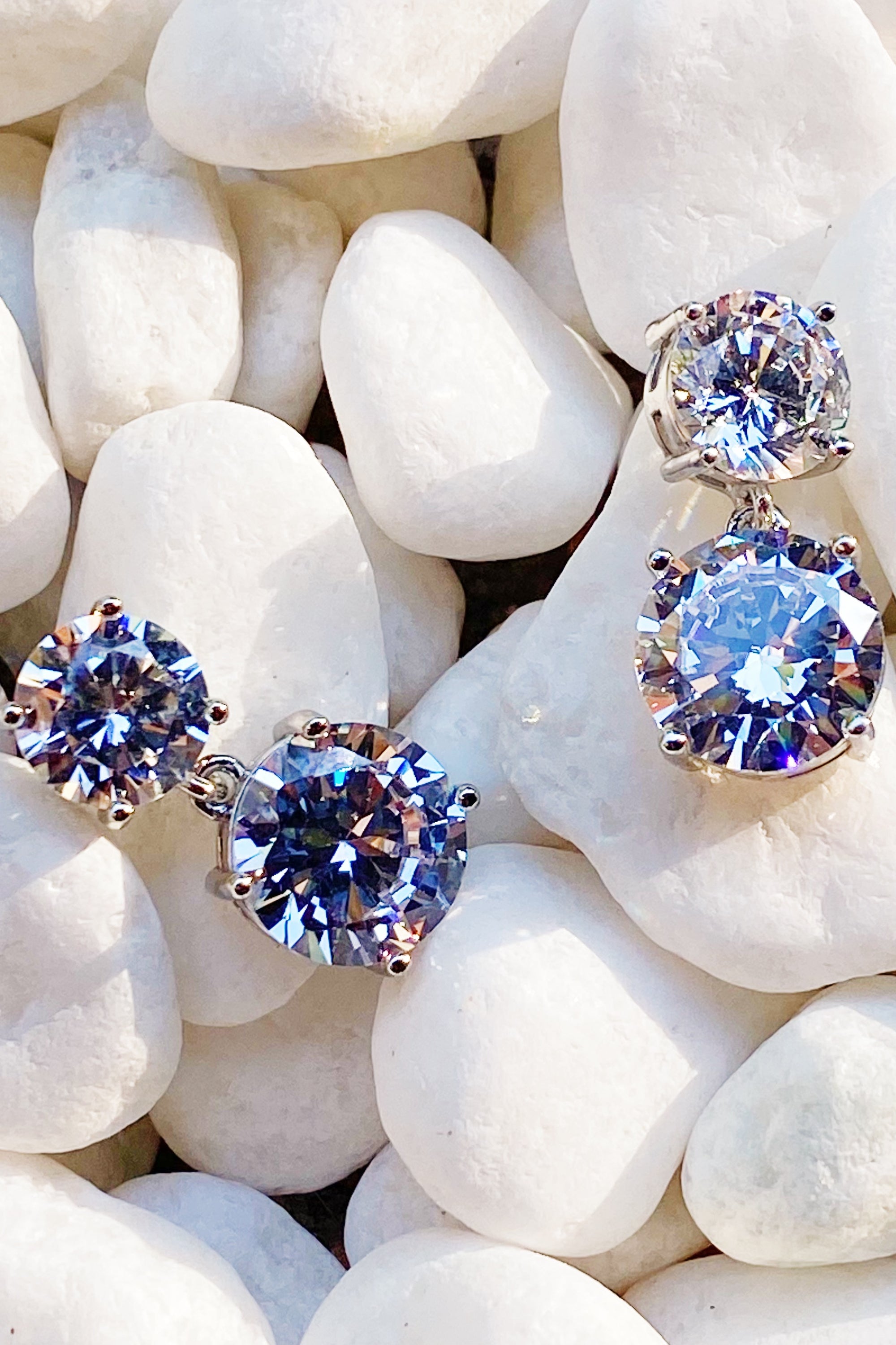 Elegant Double Diamond Dangle Earrings featuring cubic zirconia stones, rhodium plated brass, and a sophisticated design.