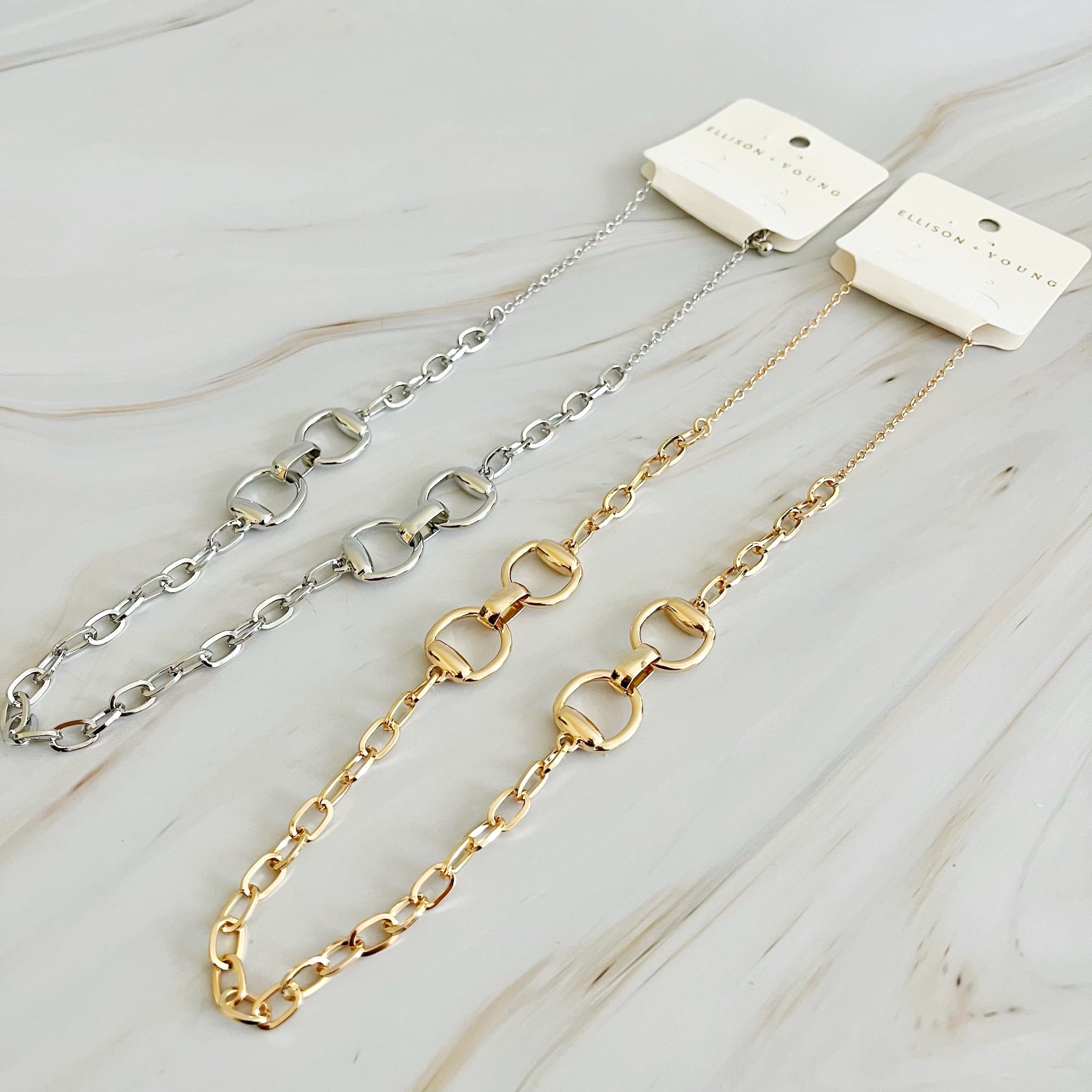 Double Equestrian Chain Necklace featuring interlocking chains in a chic design, perfect for stylish accessorizing.