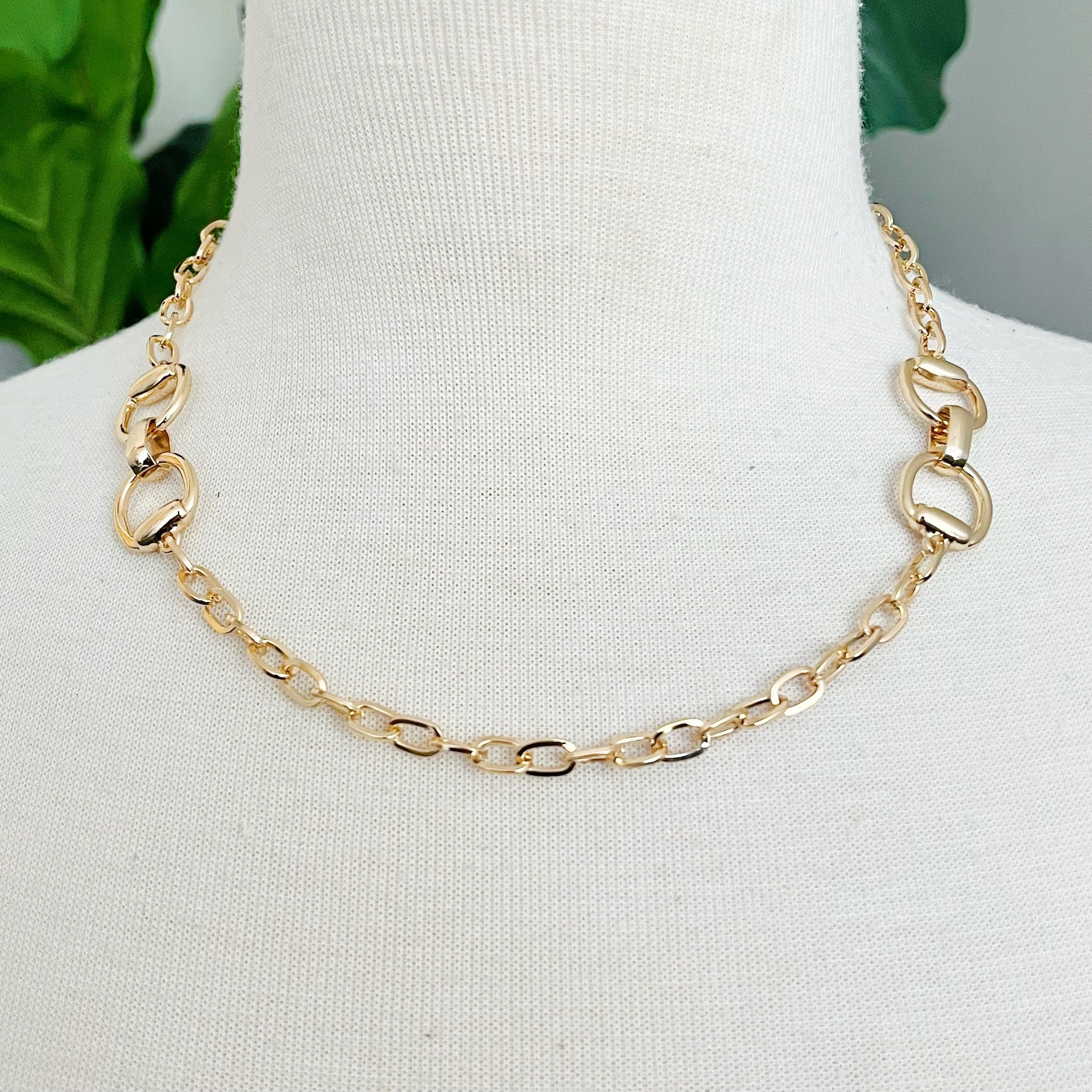 Double Equestrian Chain Necklace featuring interlocking chains in a chic design, perfect for stylish accessorizing.