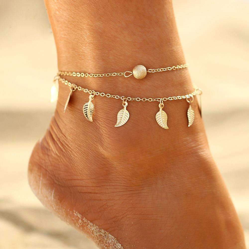 A stylish double layer feather anklet made of high-quality zinc alloy, featuring delicate feather accents and an adjustable length.