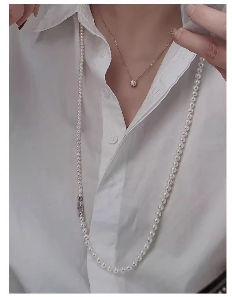 Elegant Double-Layered Pearl Choker Necklace featuring 6mm and 8mm pearls in a chic design, perfect for versatile styling.