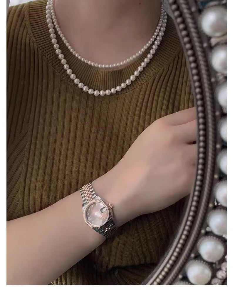 Elegant Double-Layered Pearl Choker Necklace featuring 6mm and 8mm pearls in a chic design, perfect for versatile styling.