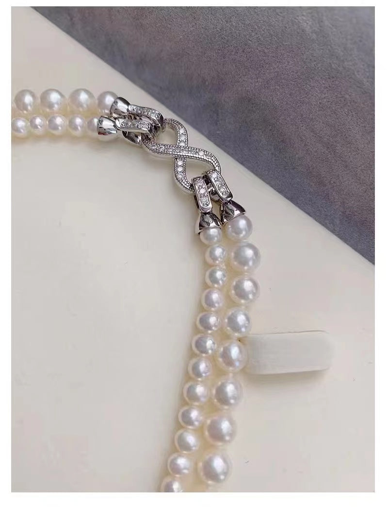 Elegant Double-Layered Pearl Choker Necklace featuring 6mm and 8mm pearls in a chic design, perfect for versatile styling.