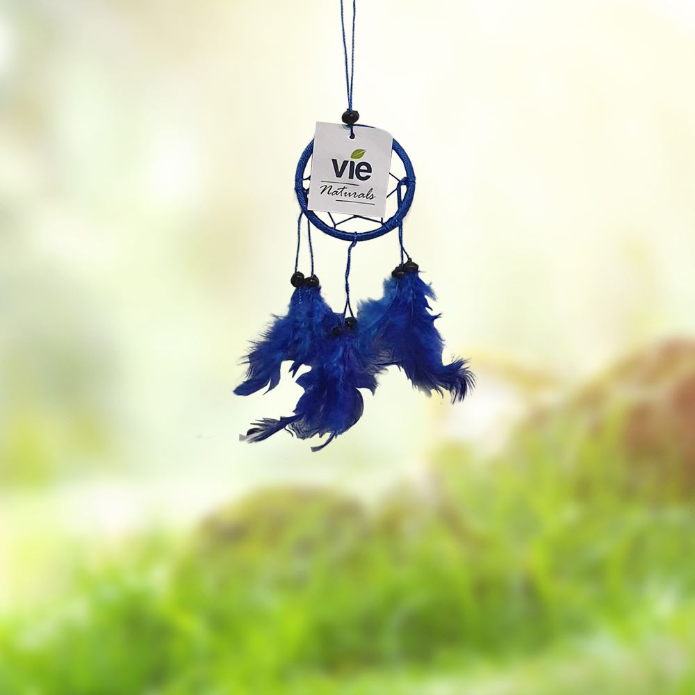 Handmade blue dream catcher with a 6cm ring, featuring a central bead and six feathers, symbolizing protection from negative dreams.