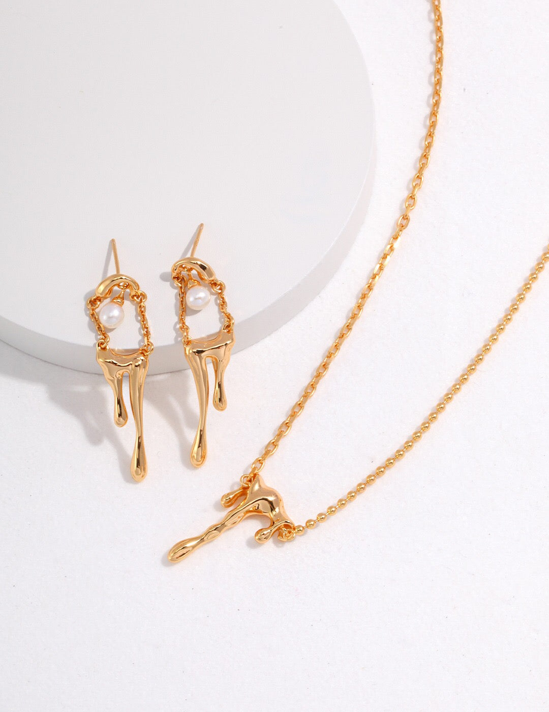 Elegant Dripping Pearl Earrings featuring natural freshwater pearls and sterling silver, showcasing a luxurious design.