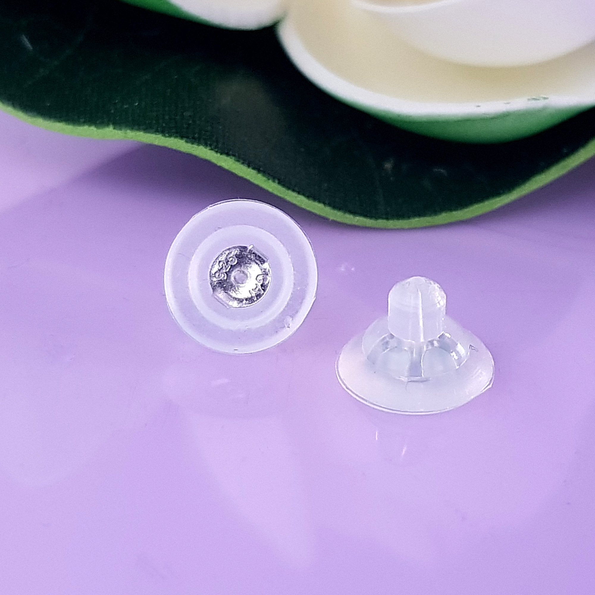 Silicone medium butterfly backs with sterling silver inserts, designed for secure and comfortable earring support.