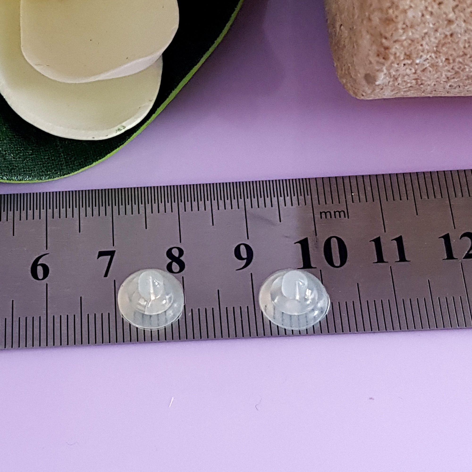 Silicone medium butterfly backs with sterling silver inserts, designed for secure and comfortable earring support.