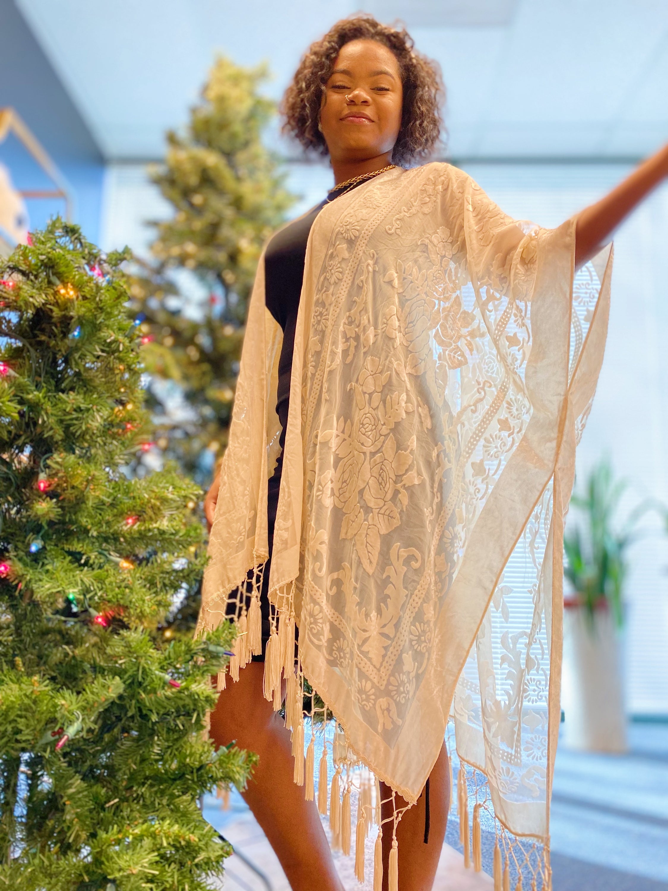 Elegant Boho Burnout Kimono featuring fringed bottoms and velvet details, showcasing its luxurious design and silky tassels.