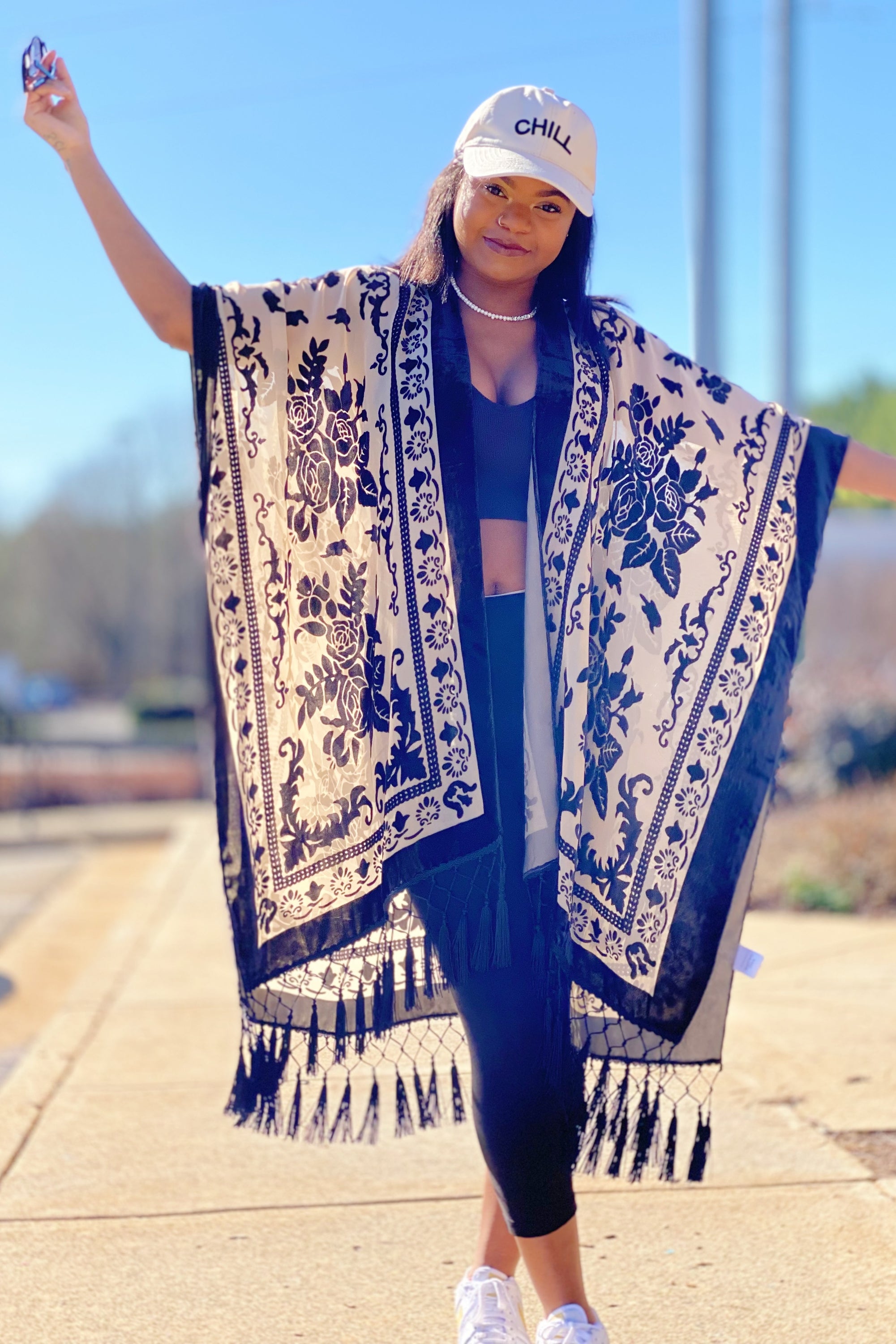 Elegant Boho Burnout Kimono featuring fringed bottoms and velvet details, showcasing its luxurious design and silky tassels.