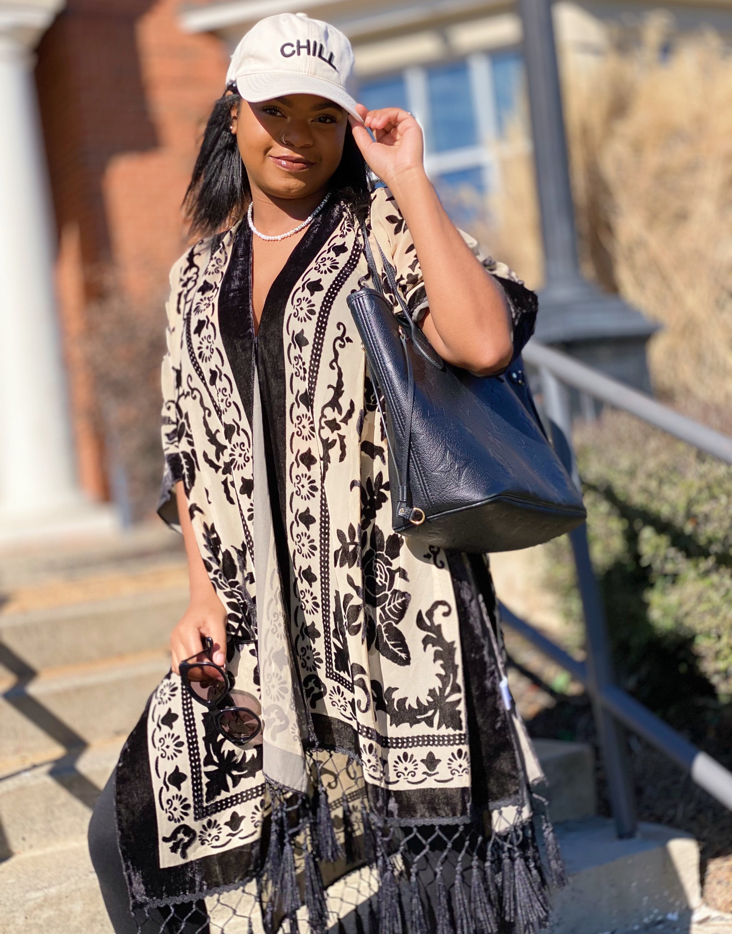 Elegant Boho Burnout Kimono featuring fringed bottoms and velvet details, showcasing its luxurious design and silky tassels.