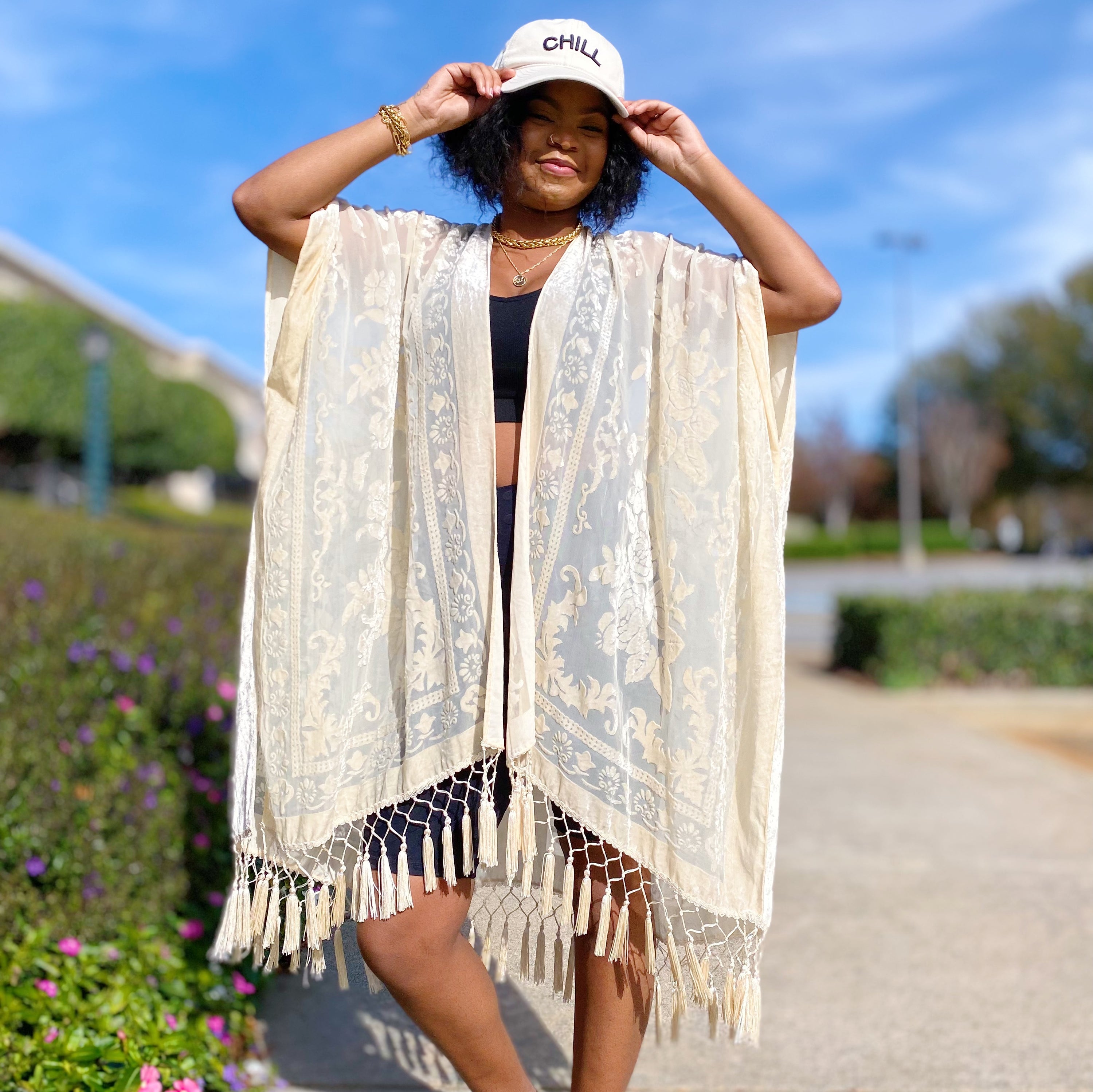 Elegant Boho Burnout Kimono featuring fringed bottoms and velvet details, showcasing its luxurious design and silky tassels.