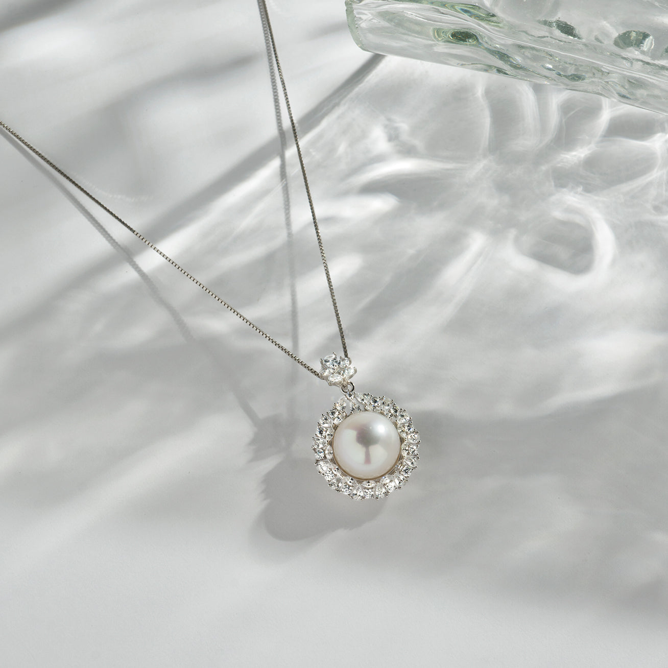 Elegant Edison Pearl Necklace featuring a 12-13mm lustrous pearl and cubic zirconia accents on Sterling Silver with 18k Gold Plating.