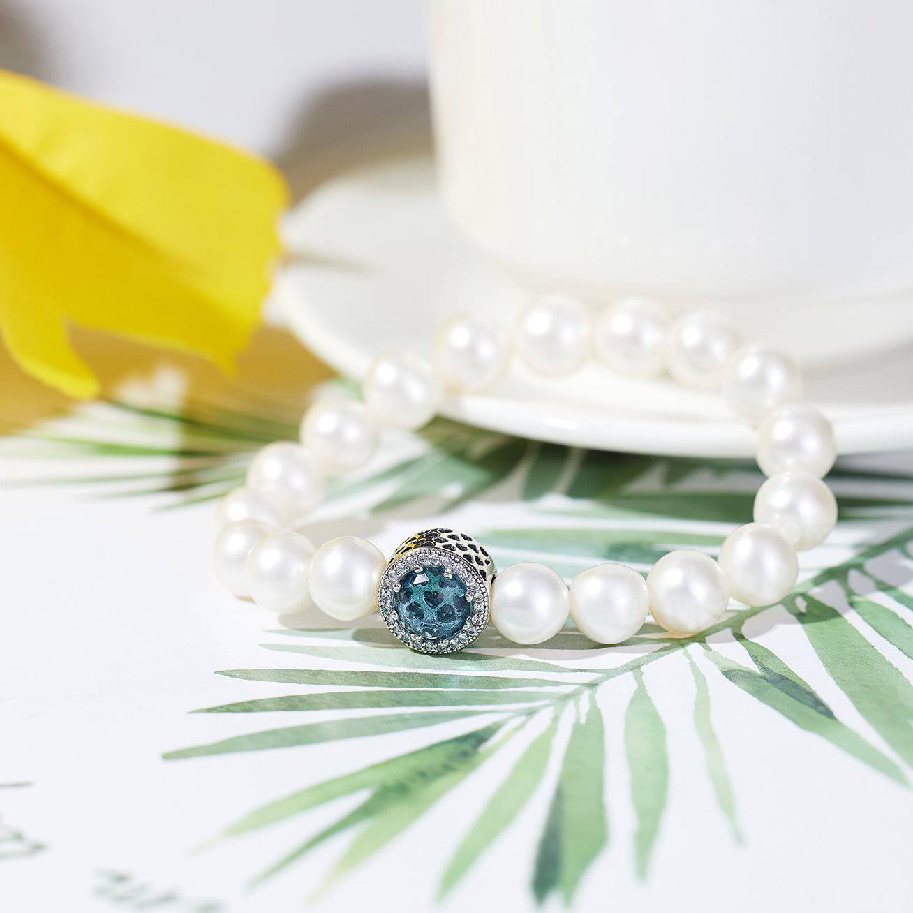 Elegant Freshwater Pearl Bracelet WB00039 featuring white pearls and sapphire blue cubic zirconia, set in gold-plated sterling silver.