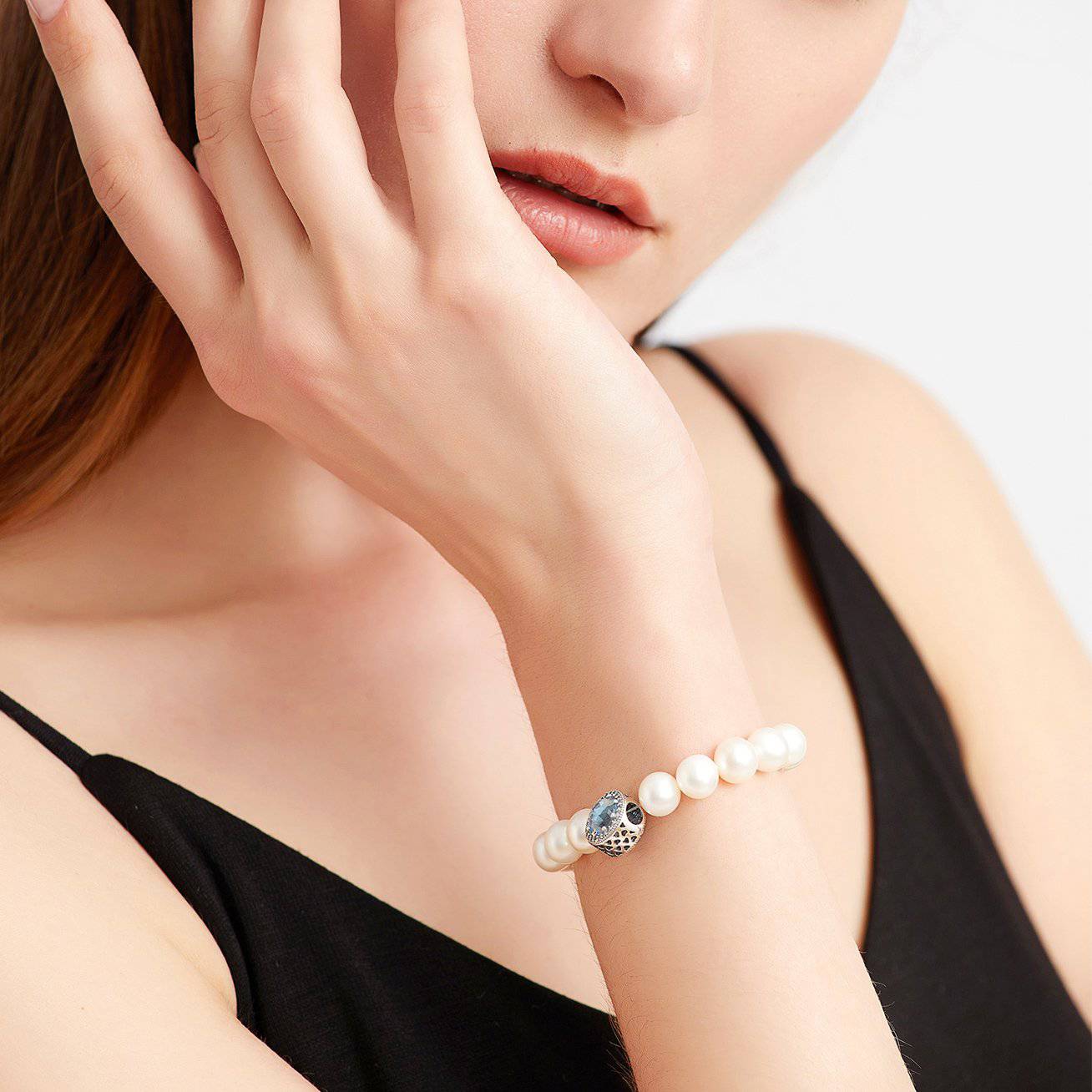 Elegant Freshwater Pearl Bracelet WB00039 featuring white pearls and sapphire blue cubic zirconia, set in gold-plated sterling silver.