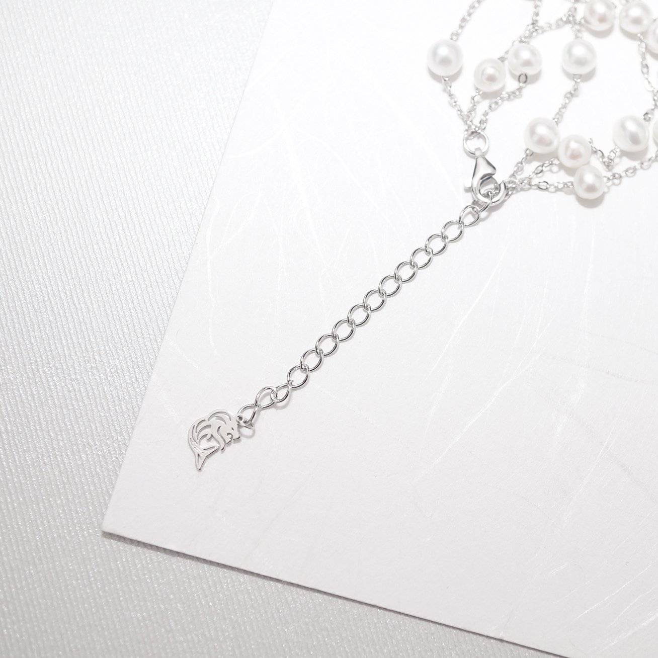 Elegant Freshwater Pearl Bracelet WB00048 featuring scattered white pearls on a sterling silver and gold plated base, showcasing a delicate and dreamy design.