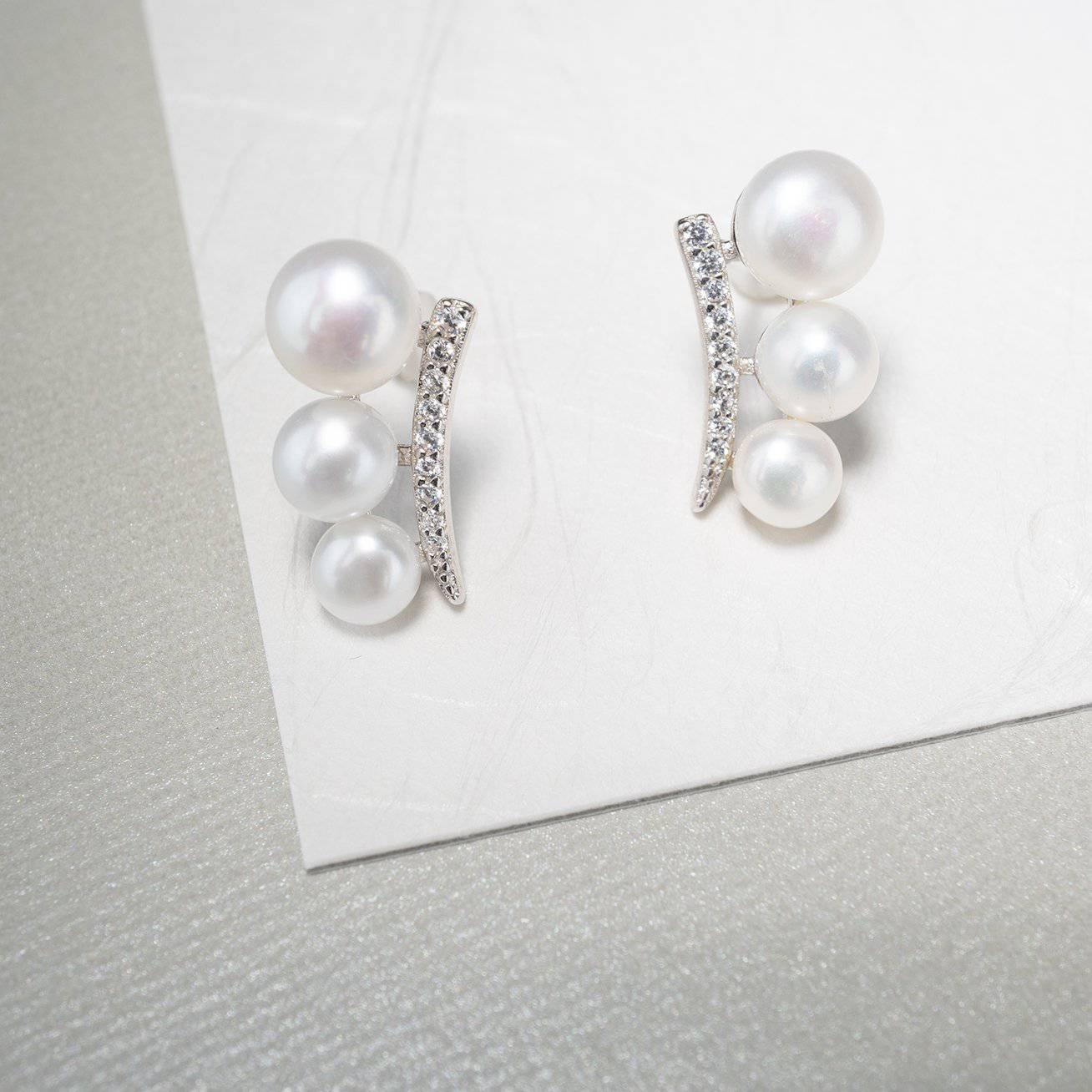 Elegant Freshwater Pearl Earrings WE00116 featuring white pearls and sterling silver with gold plating.