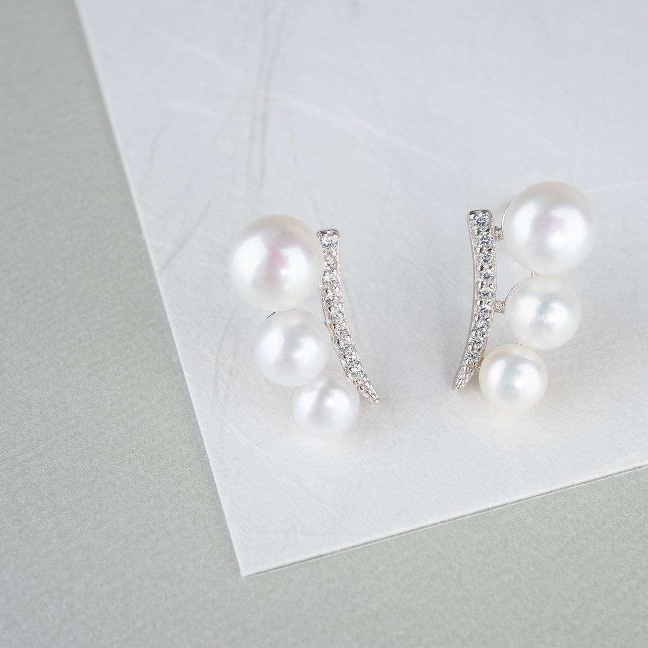 Elegant Freshwater Pearl Earrings WE00116 featuring white pearls and sterling silver with gold plating.