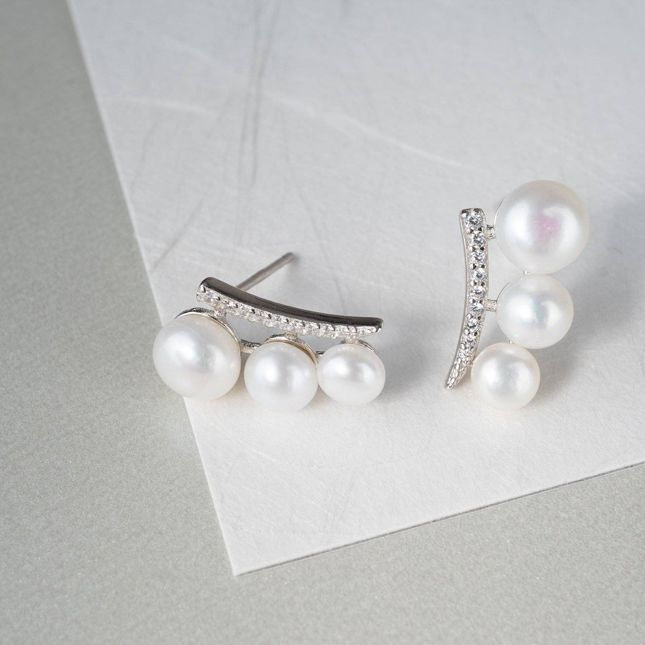 Elegant Freshwater Pearl Earrings WE00116 featuring white pearls and sterling silver with gold plating.
