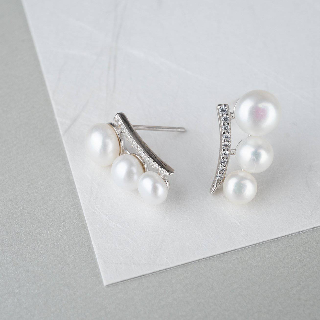 Elegant Freshwater Pearl Earrings WE00116 featuring white pearls and sterling silver with gold plating.