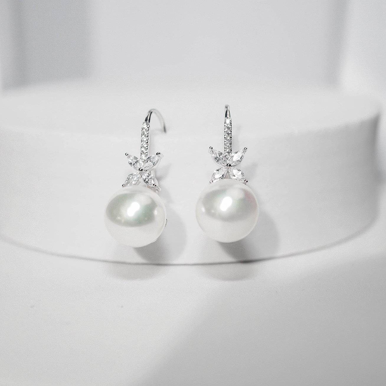 Elegant Freshwater Pearl Earrings featuring 8.5-9.5mm white pearls set in sterling silver with gold plating.