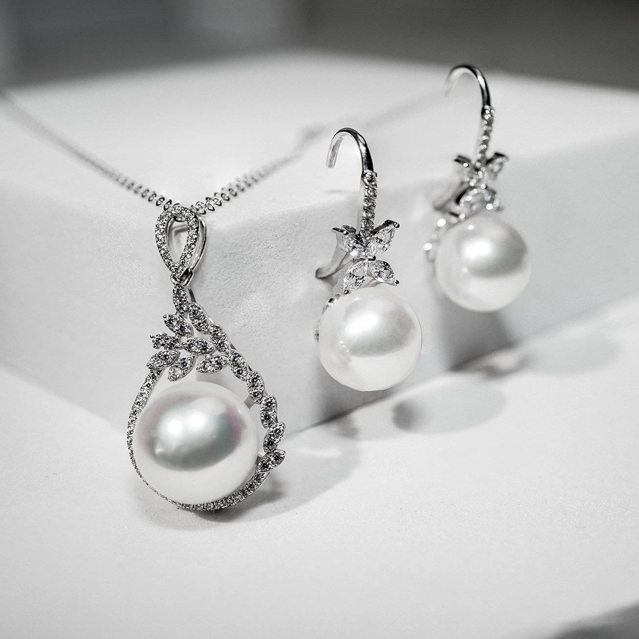 Elegant Freshwater Pearl Earrings featuring 8.5-9.5mm white pearls set in sterling silver with gold plating.