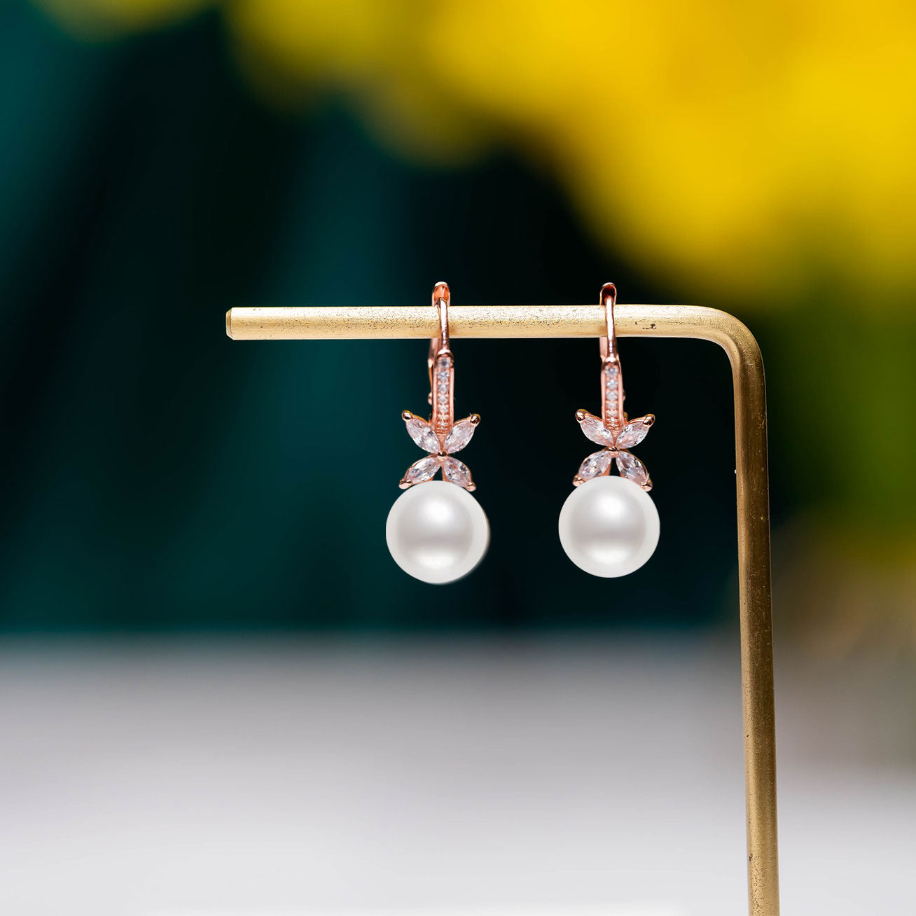 Elegant Freshwater Pearl Earrings in rose gold with 8.5-9.5mm white pearls and cubic zirconia accents.