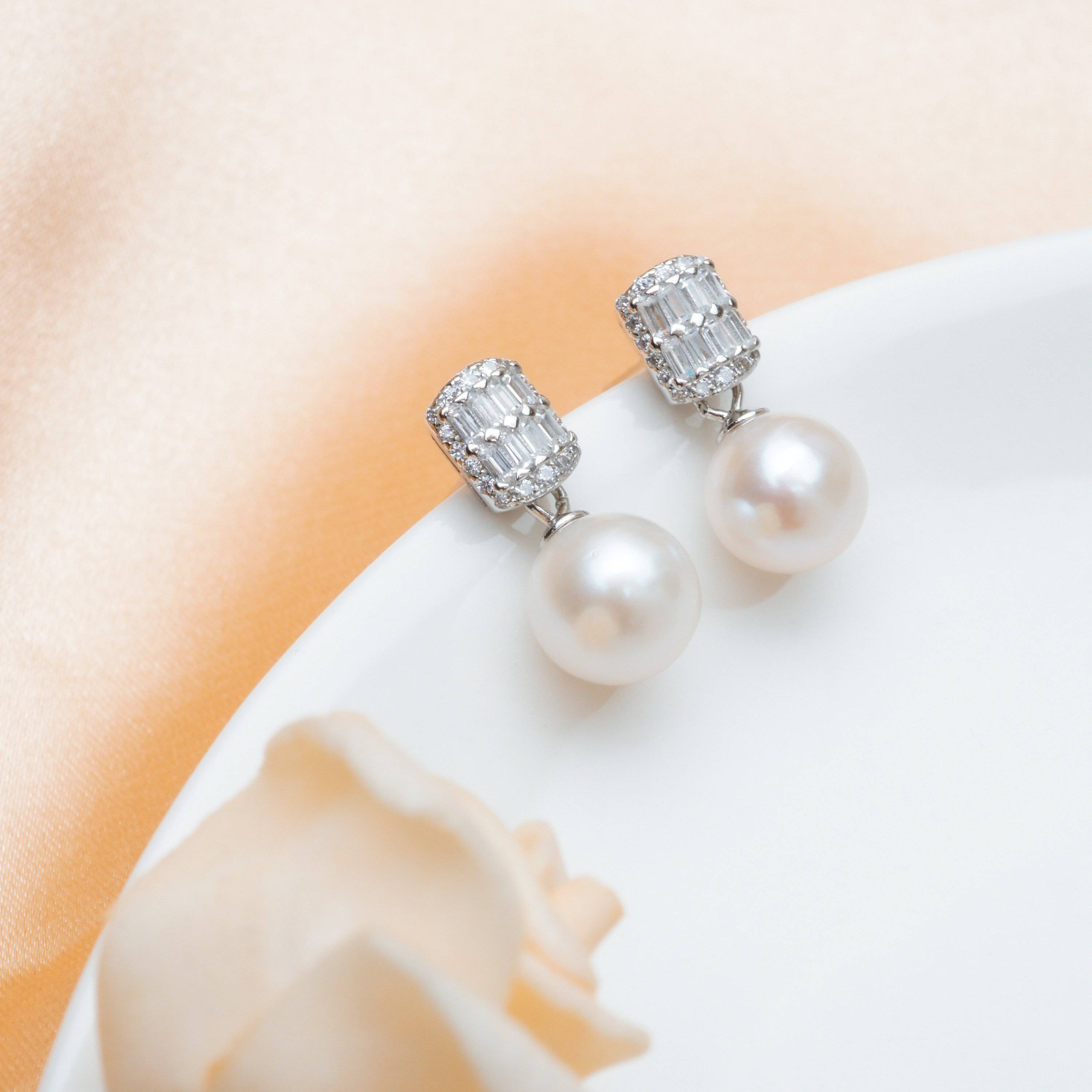 Elegant Freshwater Pearl Earrings WE00066 featuring round white pearls and sterling silver with gold plating.