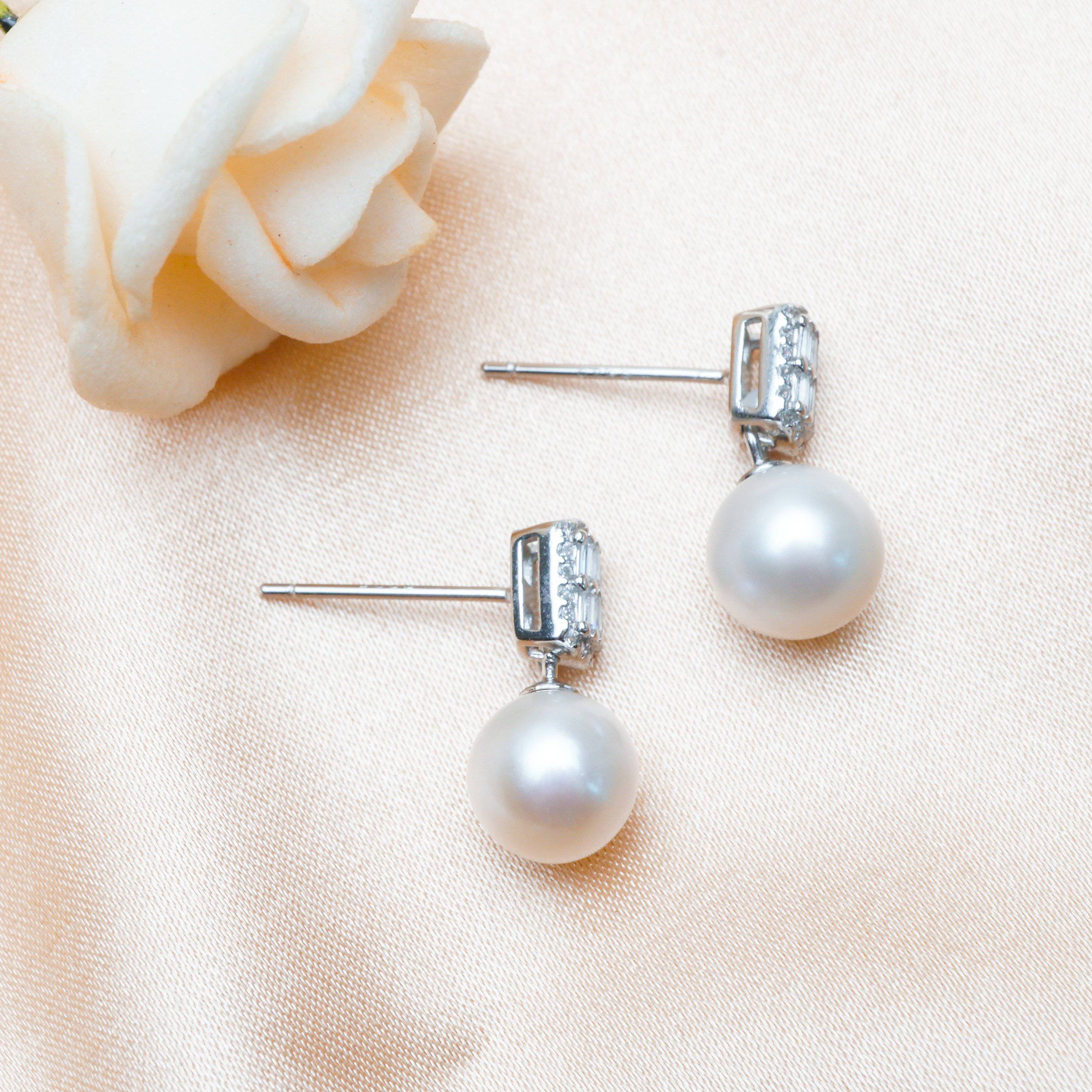 Elegant Freshwater Pearl Earrings WE00066 featuring round white pearls and sterling silver with gold plating.