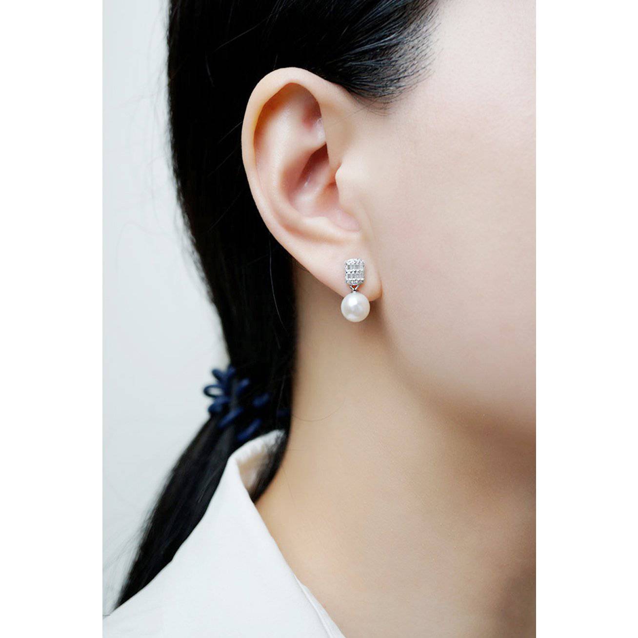 Elegant Freshwater Pearl Earrings WE00066 featuring round white pearls and sterling silver with gold plating.