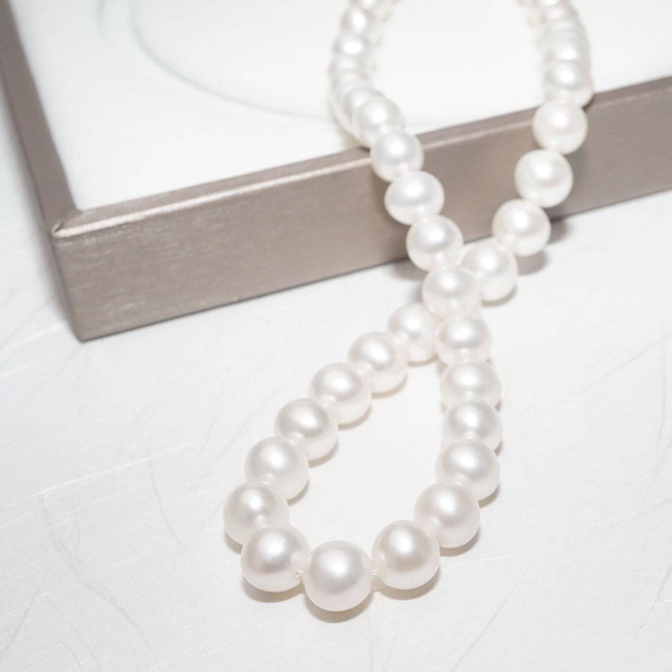Elegant Freshwater Pearl Necklace WN00094 featuring classic round white pearls with a sterling silver clasp and gold plating.