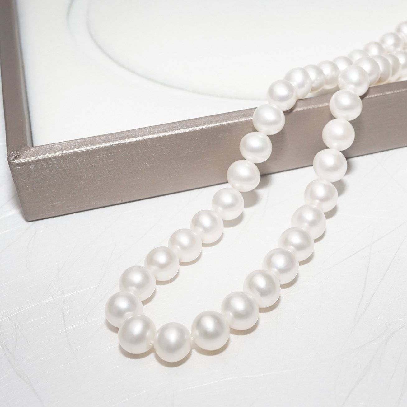 Elegant Freshwater Pearl Necklace WN00094 featuring classic round white pearls with a sterling silver clasp and gold plating.