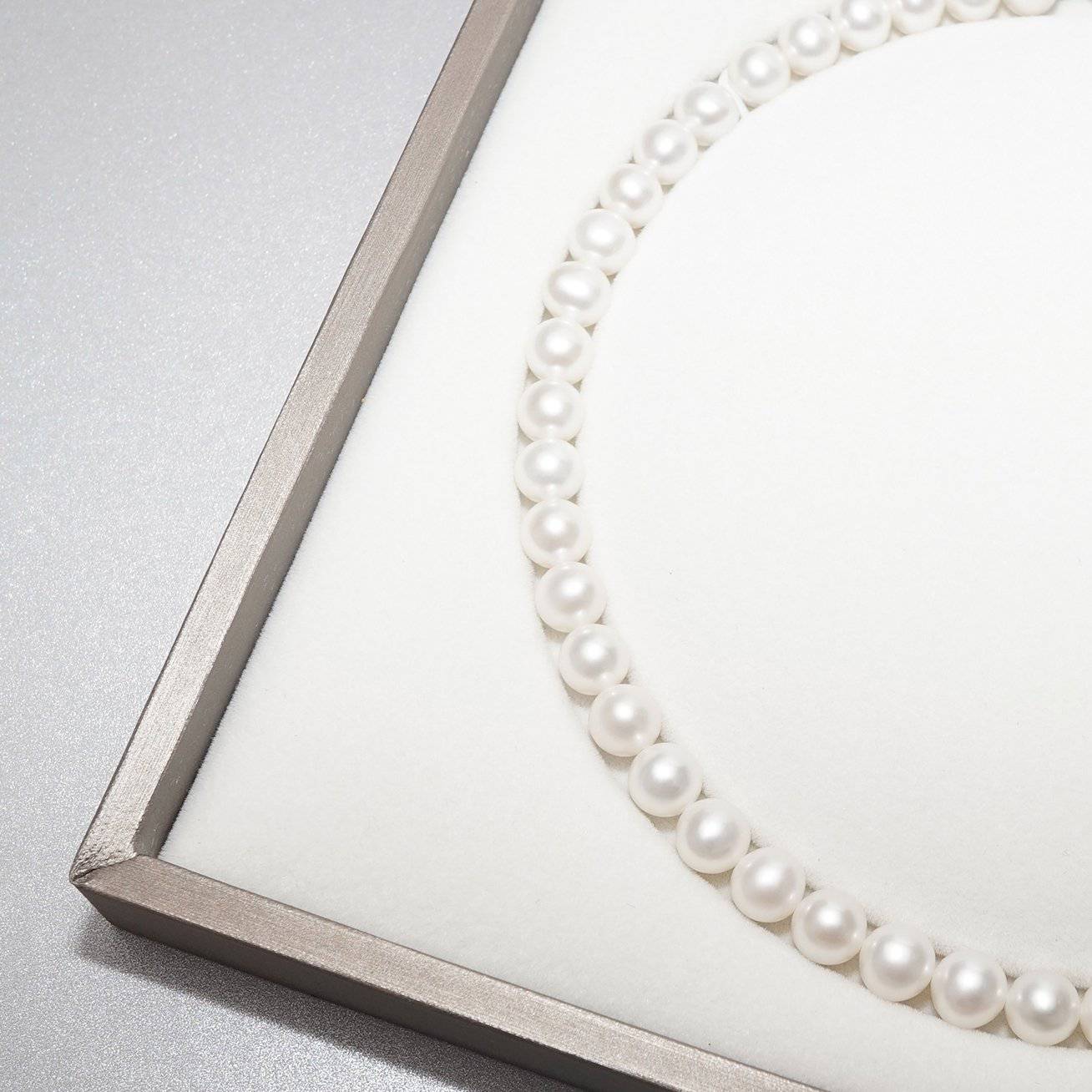Elegant Freshwater Pearl Necklace WN00094 featuring classic round white pearls with a sterling silver clasp and gold plating.