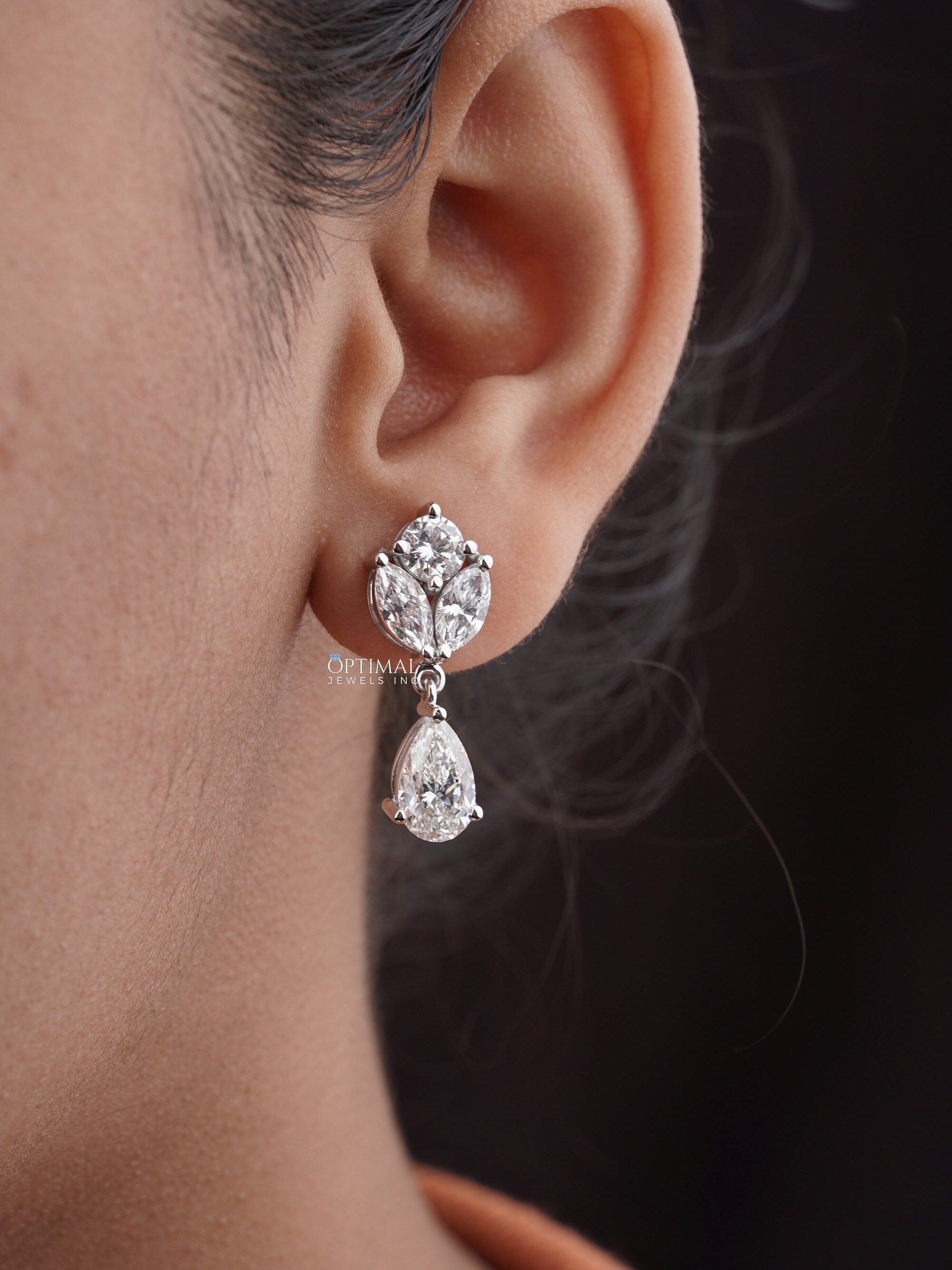 Elegant Multi Lab Grown Diamond Earrings featuring pear, round, and marquise cut diamonds, showcasing 5.00 Ctw in a stunning design.