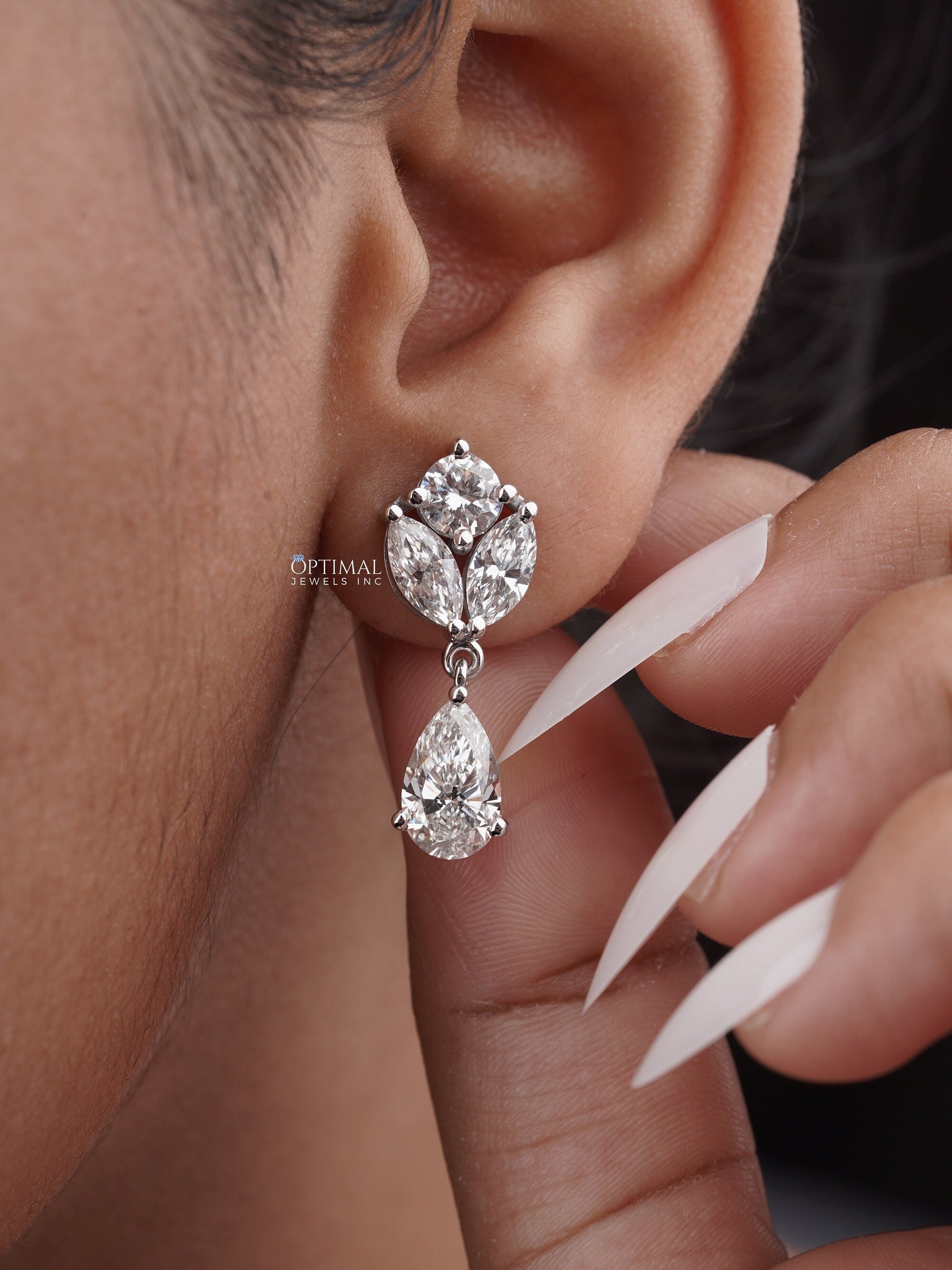 Elegant Multi Lab Grown Diamond Earrings featuring pear, round, and marquise cut diamonds, showcasing 5.00 Ctw in a stunning design.