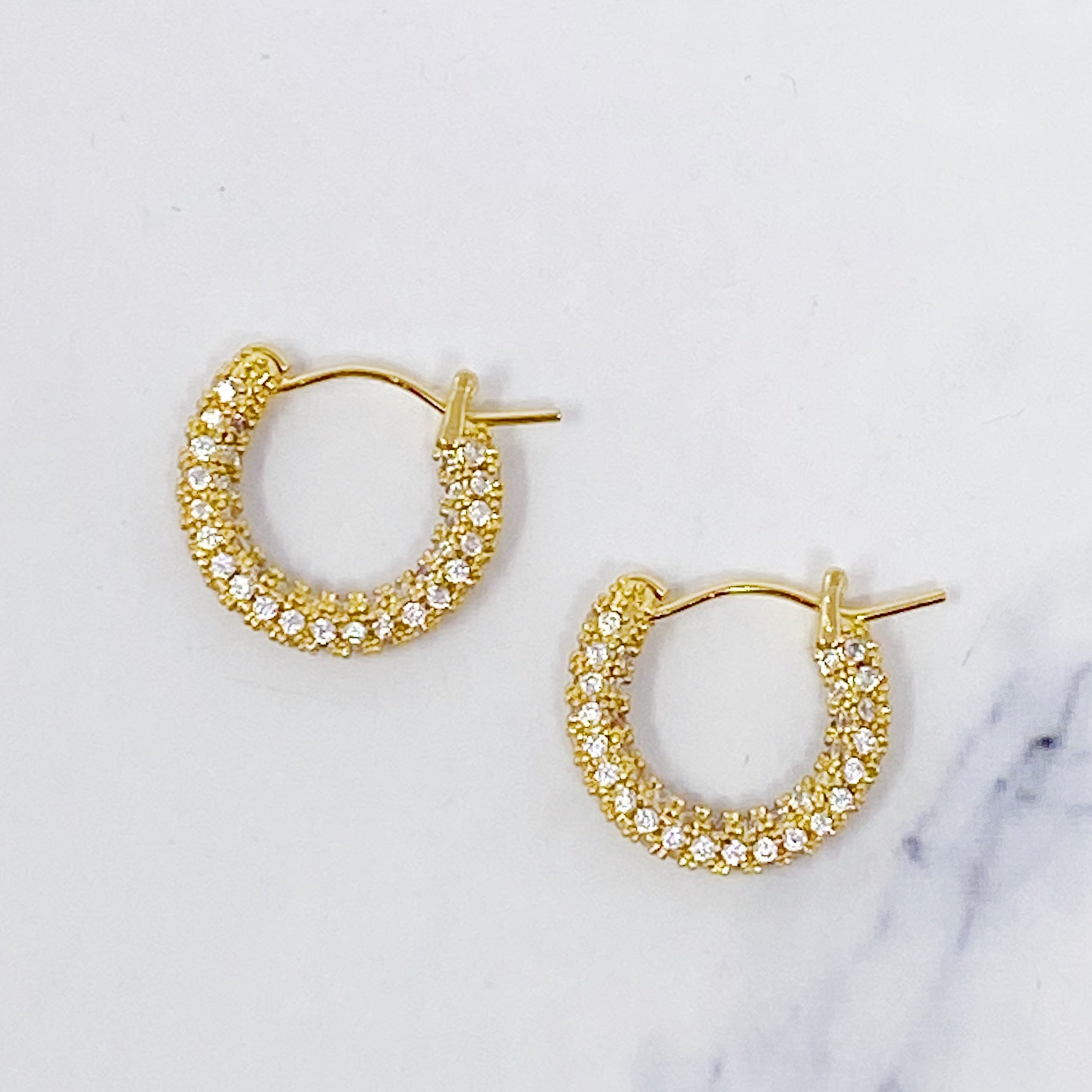 Elegant Shine Hoop Earrings featuring gold plating and sparkling cubic zirconia stones, perfect for any occasion.