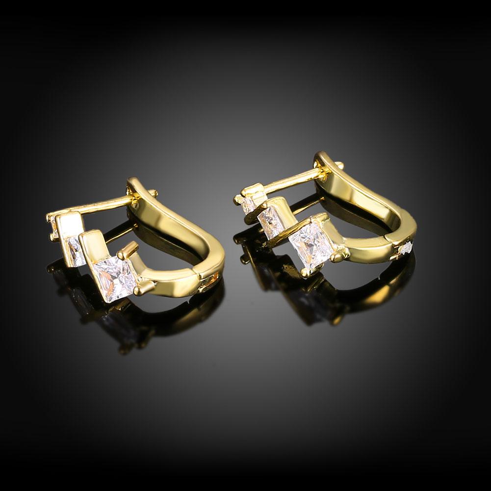 Elegant Elements Intertwined Clip On Earrings featuring certified crystals and 18K gold plating, designed for comfort and style.