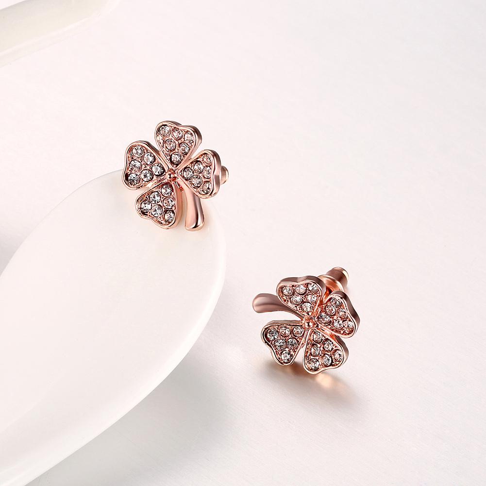 Elegant Elements Pav'e Clover Studs in 14K Rose Gold with certified crystals, showcasing a delicate clover design.