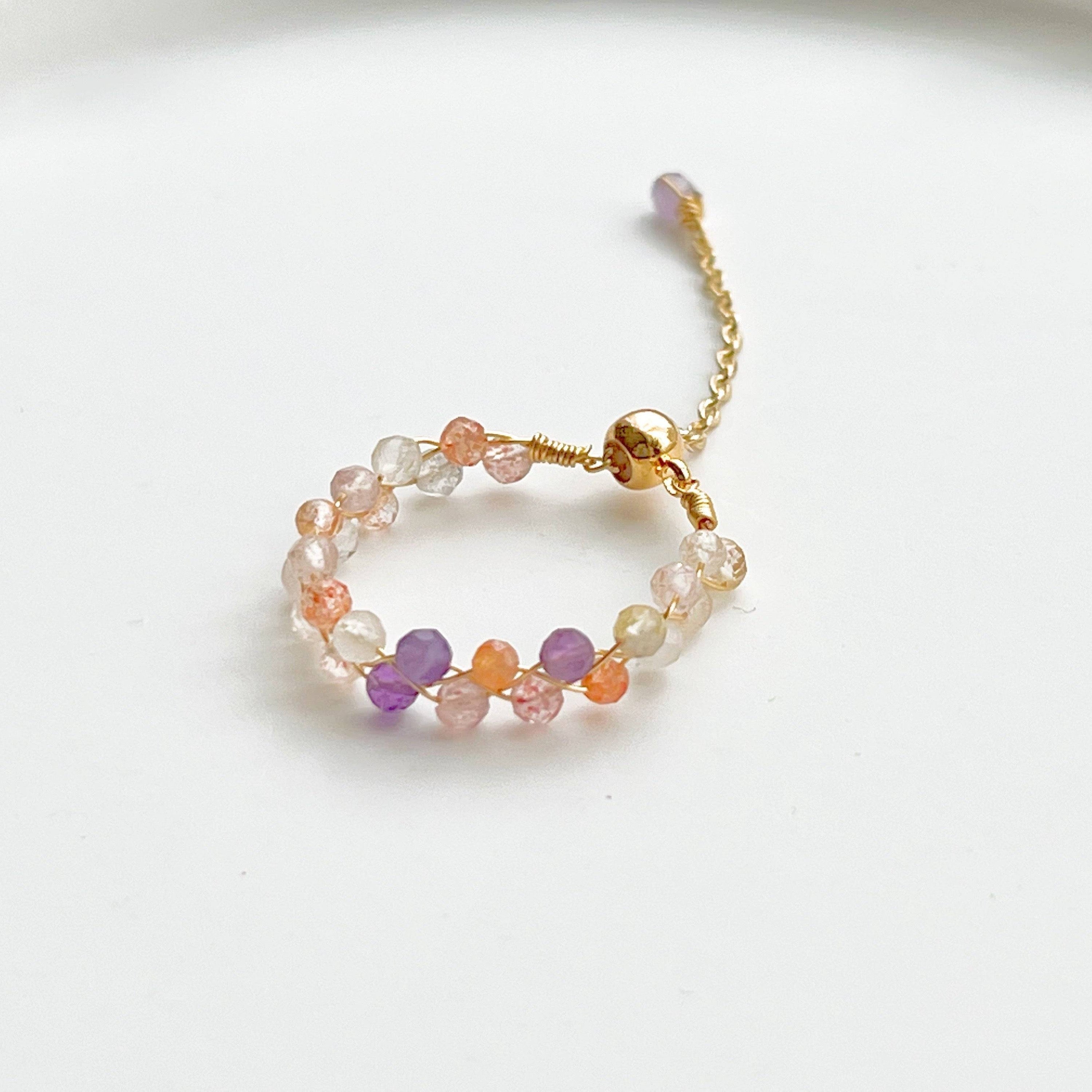 Elestial Quartz Beaded Ring featuring purple and orange natural quartz beads on a gold plated bronze adjustable band.