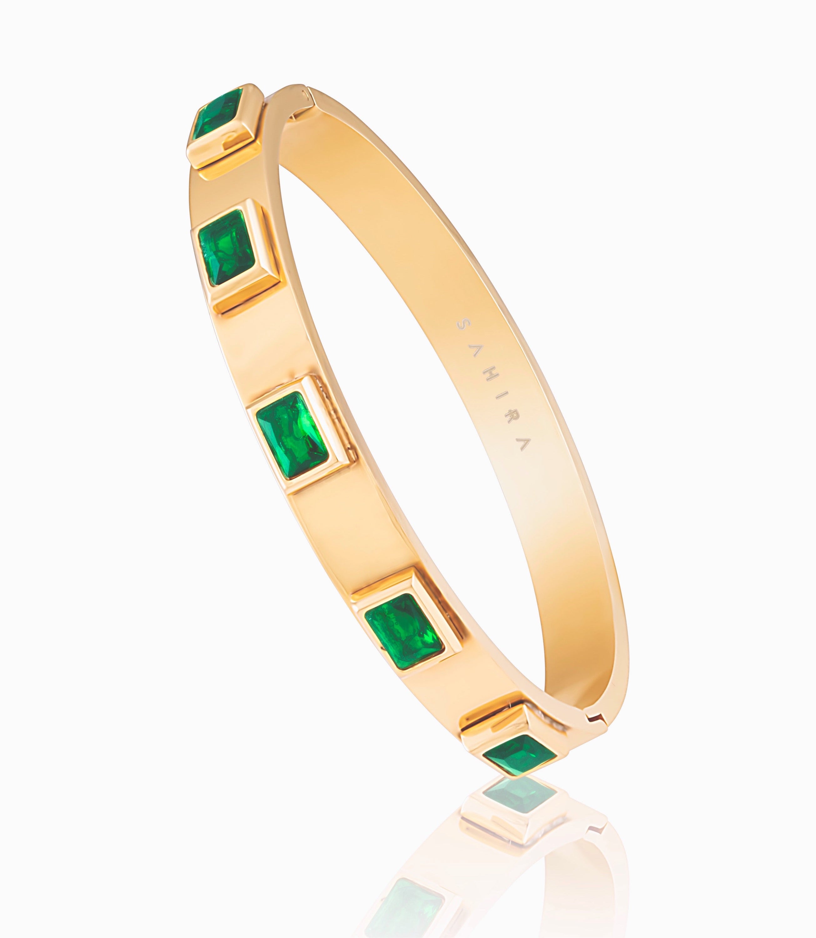 Emerald Band bracelet featuring green stones and 18k gold plating, elegantly designed for a statement look.