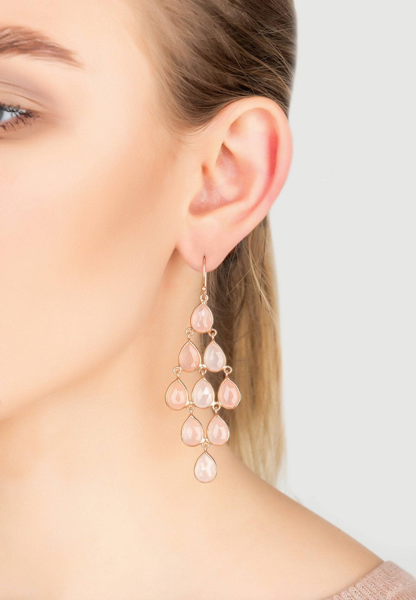 Erviola Gemstone Cascade Earrings in rose gold featuring teardrop-shaped rose quartz gemstones, elegantly designed for a stylish look.