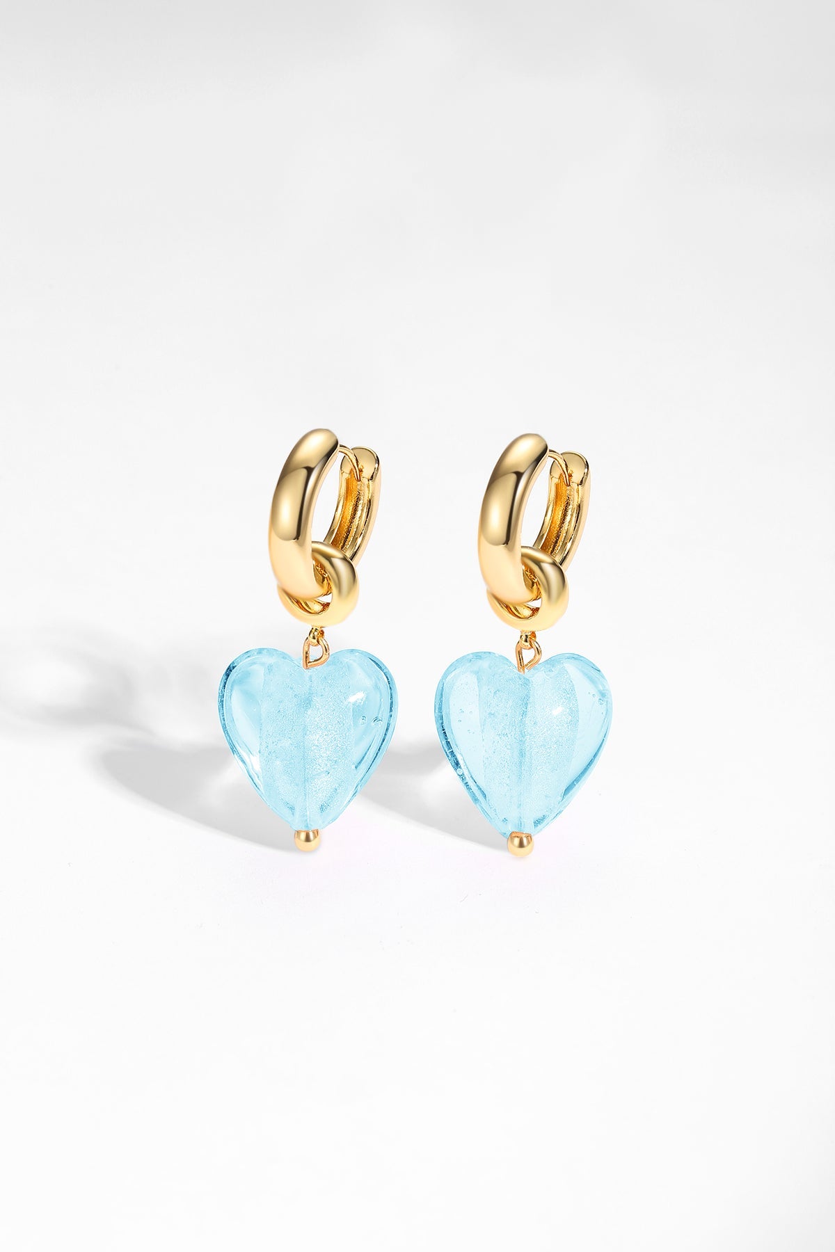 Esmée Aquamarine Glaze Heart Dangle Earrings featuring colorful glass hearts and 18k gold plated hoops.