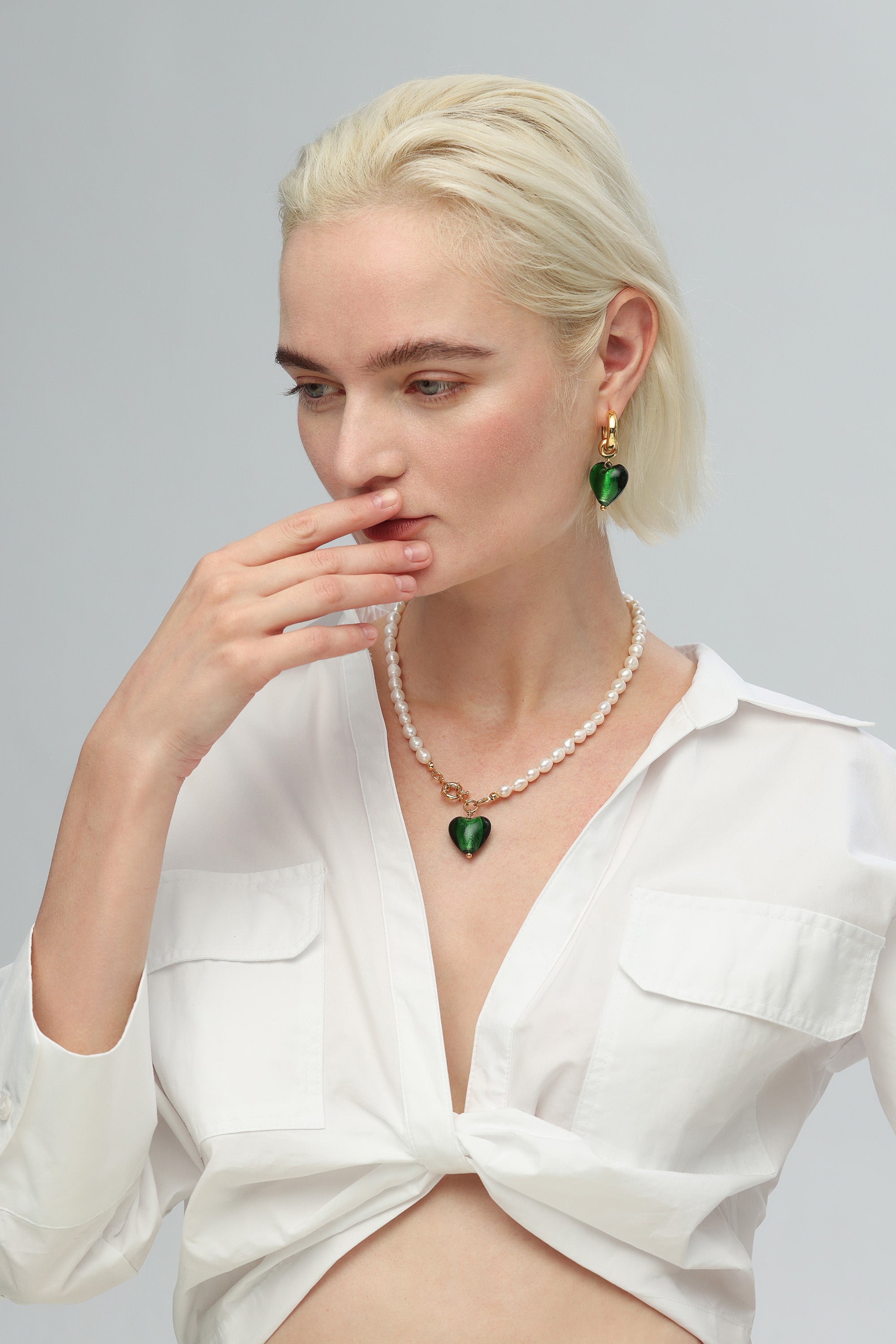 Esmée Green Glaze Heart Dangle Earrings featuring colorful glass hearts and 18k gold plated hoops.