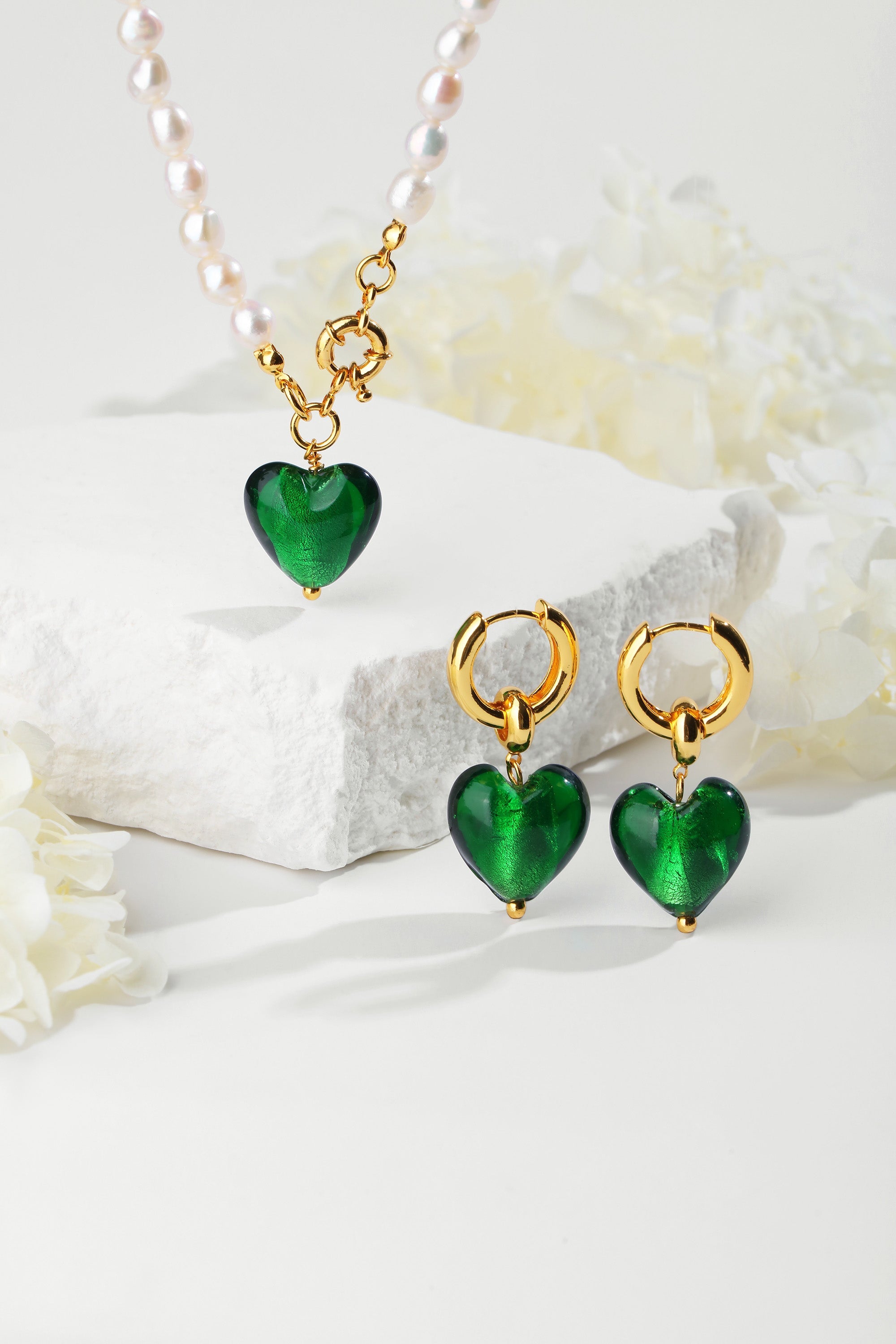 Esmée Green Glaze Heart Dangle Earrings featuring colorful glass hearts and 18k gold plated hoops.