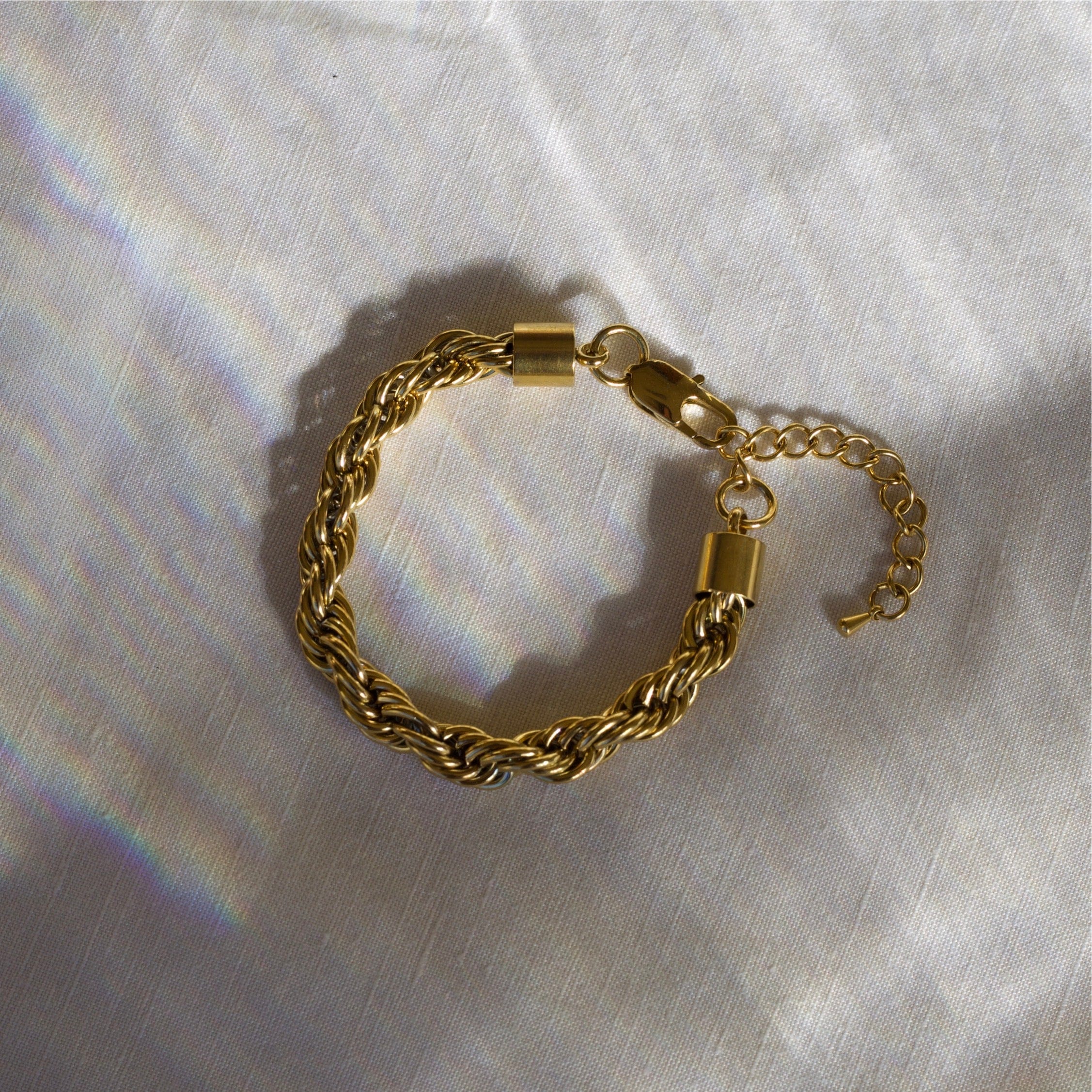 Esmeralda 8mm Twist Bracelet in gold, showcasing a chunky design with a luxurious finish, perfect for any occasion.