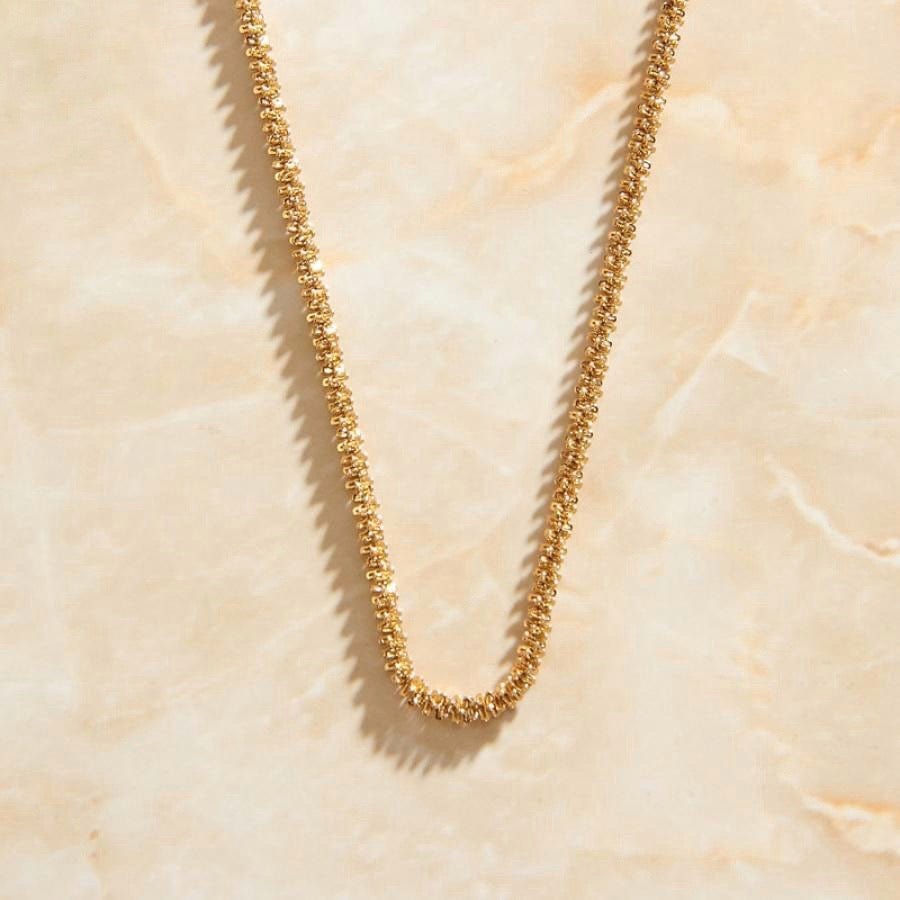 Eulalia Clavicle Babysbreath Necklace featuring a gold twist rope chain, 18K gold paved finish, and a crocodile clasp.