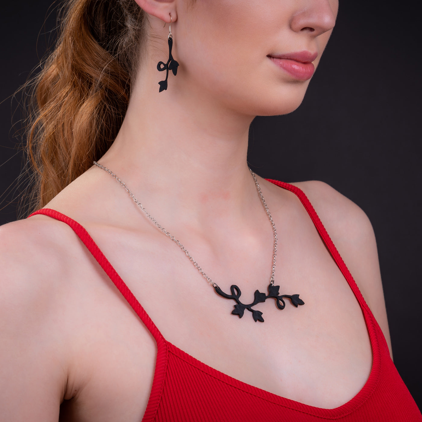 Evelyn Climbing Flower Earrings made from recycled inner tubes, featuring a delicate floral design with silver hooks.