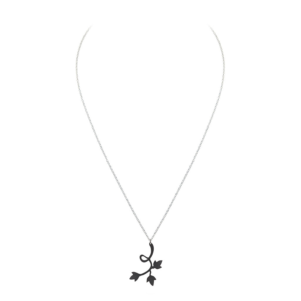 Evelyn Floral Pendant Necklace made from recycled tyre inner tubes, featuring a delicate floral design on a stainless steel chain.